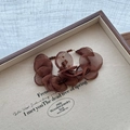 Detailed close-up of brown fabric flower earrings with crystal beads on gold metal rings - Ear Buckle Style (HE28656) / Brown