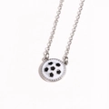 Detailed close-up of a silver-bordered soccer ball pendant necklace with sports design - Football / White Gold