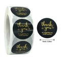 Macro detail of 1-inch black and gold Thank You stickers for small business packaging - Black Gold Small Business