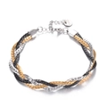 Detalle de la pulsera trenzada tricolor de acero inoxidable con hilos oro, plata y negros - Dorado Negro Acero