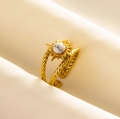 Detail of adjustable gold sunburst ring with white marble stone on soft beige fabric - Gold Tone White Stone Style (J586-G-W)