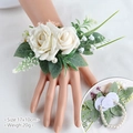 Elegant white rose wrist corsage with pearls and green leaves for wedding guest - Wrist Corsage / Ivory