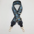 Detail of embroidered canvas strap with ethnic floral patterns and gold metal lobster clasps - Lake Blue + Black Leather + Gold Hook