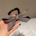 Detailed macro view of black fabric scrunchie with a sparkling rhinestone-embellished bow - Style C Scrunchie / AB Color