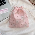 Pink seersucker drawstring pouch with cute rabbit and flower pattern for storage - Skateboard Rabbit