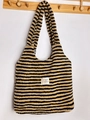 Detailed view of a striped plush lamb velvet tote bag hanging on a wooden hook rack - Vest Bag / Coffee Stripe