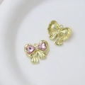 Detail showing the front and back of a pink heart crystal bow pendant for jewelry DIY - Style 33