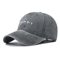 Detail of washed charcoal cotton baseball cap with white DADDY embroidery and vintage texture - DADDY Army Green