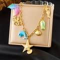 Golden ocean charm necklace with enamel mermaid tail, octopus, and starfish pendants - Ocean Theme Multi-Pendant Style (N3599)
