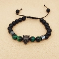 Detailed shot of adjustable bead bracelet with wolf head, tiger eye, and obsidian stones - Type C Obsidian + Green Tiger Eye