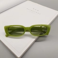 Detail view of translucent green square sunglasses with sizing info on temples - Jelly Green