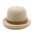 Close-up of beige knitted cloche hat featuring brown leather strap and gold buckle detail - Beige / M (56-58cm)