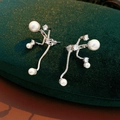 Detailed view of silver branch earrings with tiger eye stone and zircon in velvet box - Pearl Branch Style / Silver-White
