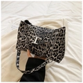 Fashionable leopard print shoulder bag with silver chain strap and metal T logo detail - Black