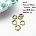 Detail view of 10mm antique bronze textured ring spacers with size specifications - 5# (10mm Diameter)