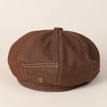 Close-up of dark brown denim beret featuring contrast white stitching and retro metal badge - M(56-58cm) / Coffee