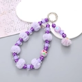 Handmade purple beaded phone wristlet with plush ball, cherry and flower charms - Purple Pompom Pendant Style (K2672)