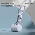 Portable pet waste scooper with long handle in light gray color on blue background - Gray