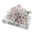 Artificial white violet bouquet with purple veins on a book, elegant floral decor - White
