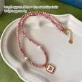 Pink stone beaded necklace with golden butterfly pendant and white pearl accents - Rhodochrosite Pearl Necklace XL0764
