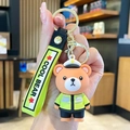 Portachiavi orsetto poliziotto marrone con gilet giallo e cinturino in silicone - Orso Vigile