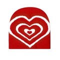 Macro detail of the red knitted beanie showing the soft texture and jacquard heart pattern - Red White Heart