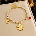 Bracciale intrecciato bohémien con ciondoli margherita dorata, luna e cuore rosso - Stile Girasole Luna Cuore Rosso (B1817)