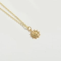 Close-up of gold starburst necklace with religious relief and white zircon inlay - Sun Style (XL3284-1)
