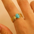 Close-up of bohemian 18K gold plated leaf ring featuring a natural oval turquoise stone - 44 18k Pure Gold Wg1-031