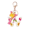 Resin letter W keychain with pink tassel, butterfly charm, and dried flowers - Flower Pattern W