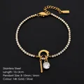 Exquisite 14K gold plated stainless steel tennis bracelet with a sparkling crystal pendant - L