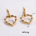 Golden stainless steel heart earrings featuring a unique bamboo texture design - Amleh041