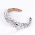 Baroque sponge headband featuring sparkling silver rhinestones on a white stand - Silver