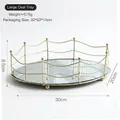 Oval golden mirror jewelry tray with woven metal fence and spherical support feet - Large Oval Lace Mirror Tray / Gold