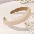 Detailed close-up of white satin sponge headband with non-slip velvet inner lining - White
