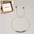 Adjustable woven rope bracelet with emerald green gemstone beads and golden metal accents - May-Emerald (Boxed Set)