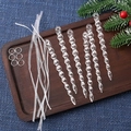Detail of six clear acrylic icicle ornaments with silver rings and white ribbons on a tray - Twisted Icicle 13.5CM (Set of 6)