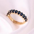 Adjustable gold plated ring featuring a row of ten sparkling dark blue oval zircons - Adjustable Open / Sapphire Blue Zirconia