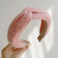 Detailed view of a pink plush knitted headband with a soft mohair-style twisted knot - Cross Knot / Pink