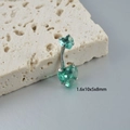 Macro shot of silver heart zircon navel ring on stone showing size 1.6x10x5x8mm - Silver Green Zirconia