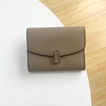 Short elephant grey pebbled leather wallet with silver buckle and bifold design - Khaki
