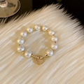 Detail of warm white pearl bracelet featuring a gold round clasp with sparkling crystals - 5# Bracelet-Warm White Pearl-Rhinestone Buckle