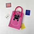 Detailed view of pink knitted mini bag featuring a black cat pattern and clear pink handle - Sleeping Cat Pink
