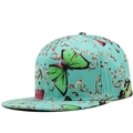 Detail of turquoise flat brim baseball cap featuring butterfly and gold filigree patterns - Adjustable / Flat Brim / Turquoise Butterfly
