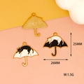 Detail view of cat and umbrella charms showing 25mm dimensions and metal texture - Sleepy Cat on Umbrella