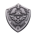 Minimalist silver shield pin with embossed bird and triangle motifs on white background - Vintage Shield
