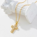 Close-up of gold-plated cross pendant with sparkling white cubic zirconia micro-pave - Gold/Pave Zirconia Cross/T