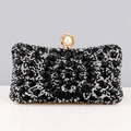 Luxury rhinestone evening clutch featuring black and silver flower patterns and gold clasp - Black