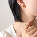 Minimalist gold jewelry set featuring brown stone studs and pearl ring on model - Coffee / Gold Color (F097)