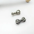 Detailed macro view of Tibetan silver vajra bell charms for DIY Buddhist jewelry making - Ritual Tool Accessory (17# Pair) / 1 Pair Pack / Silver